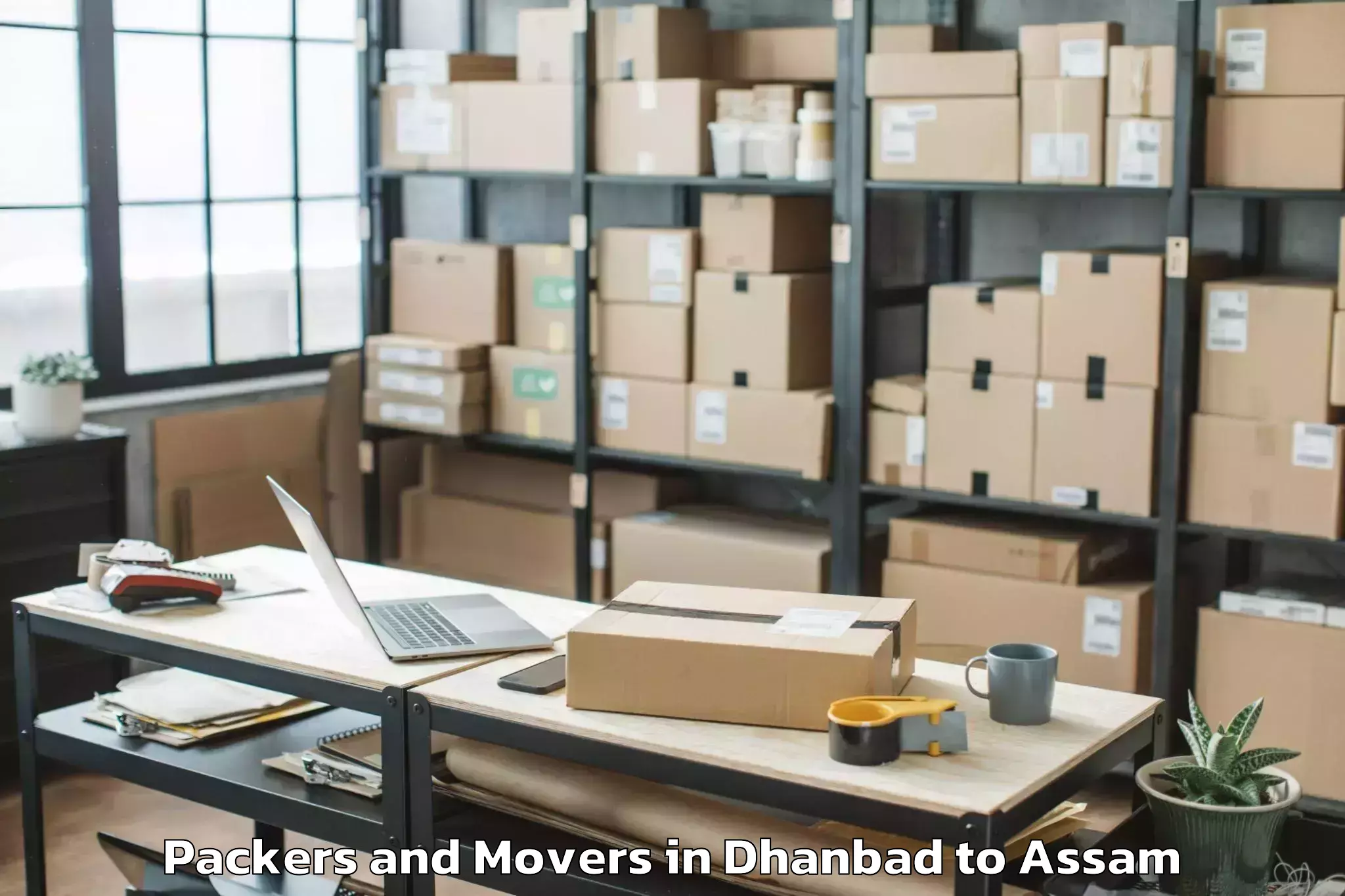 Quality Dhanbad to Pachim Nalbari Packers And Movers